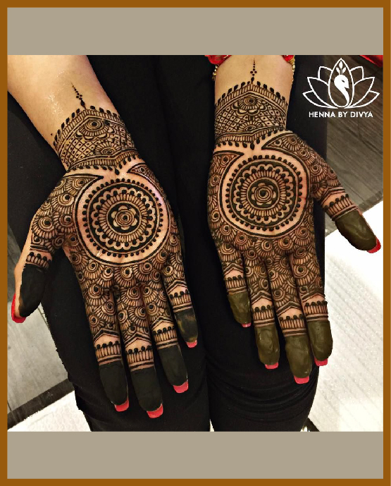 Stylish front hand mehndi design with detailed mandala and flowers Stylish front hand mehndi design with detailed mandala and flowers